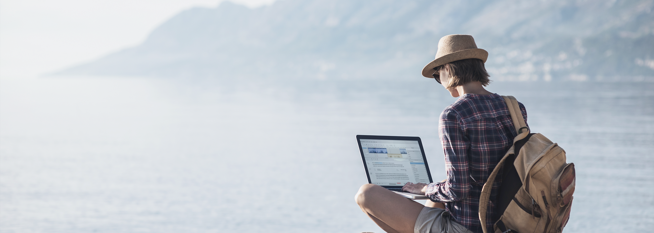 Girl with hat and daypack a pictures remote lake scenery Editing Audio in Hindenburg Pro 2 Lightmode on a Laptop