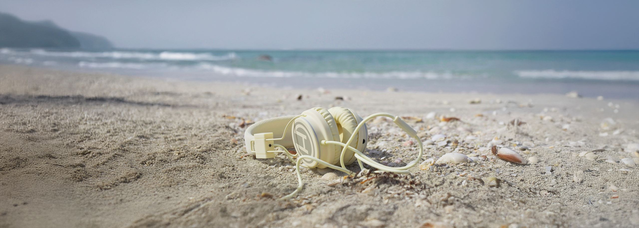 Long version of Headphones in the Sand on a Deserted Island Beach: An Illustration of the Ten Best Podcasts for Solitary Listening.