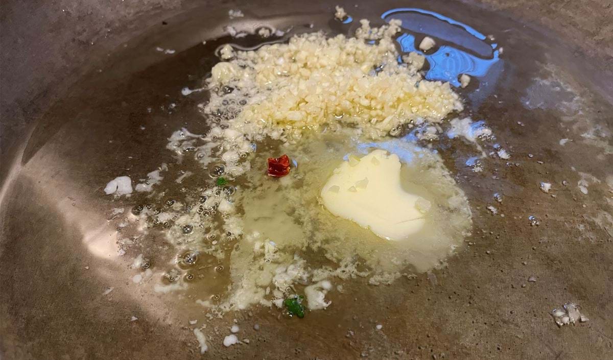 Iron Pan with Garlic, Olive Oil, Butter, and Chilli” serves as a metaphor for the craftsmanship in audio editing within Hindenburg Pro, illustrating the blend of precision, care, and passion needed to create something truly exceptional