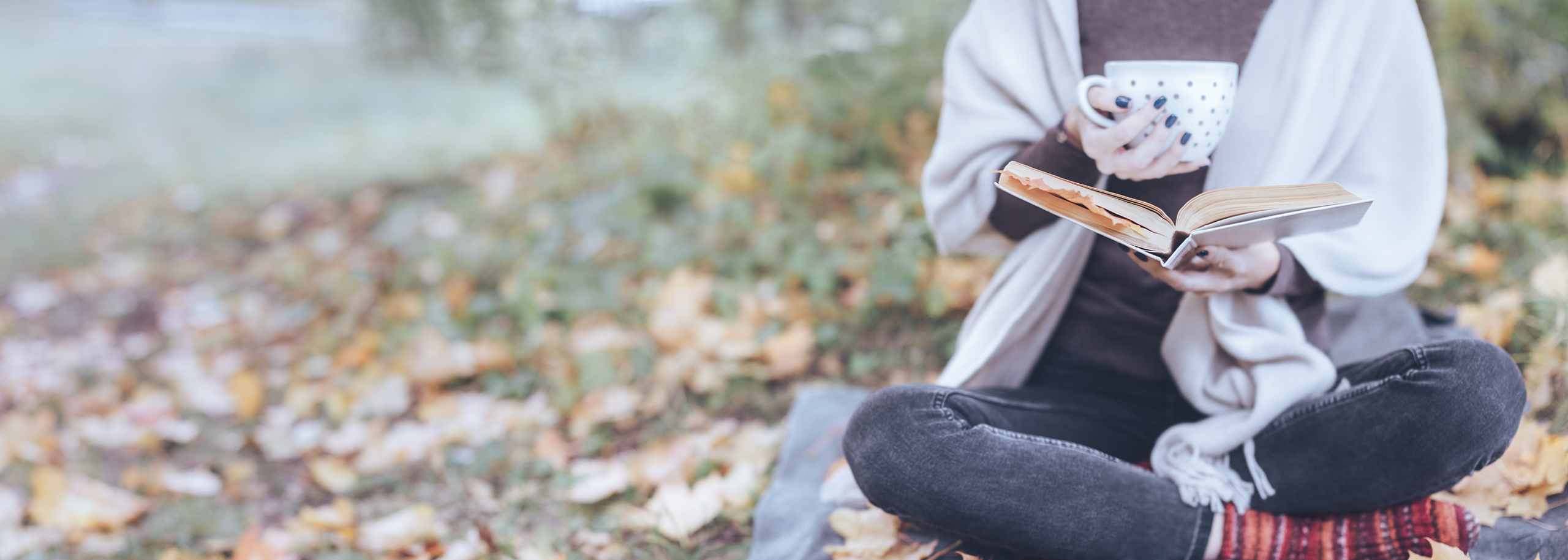 Girl in Forest Scenery Reading Analog Book Drinking Tea from a big dotted mug